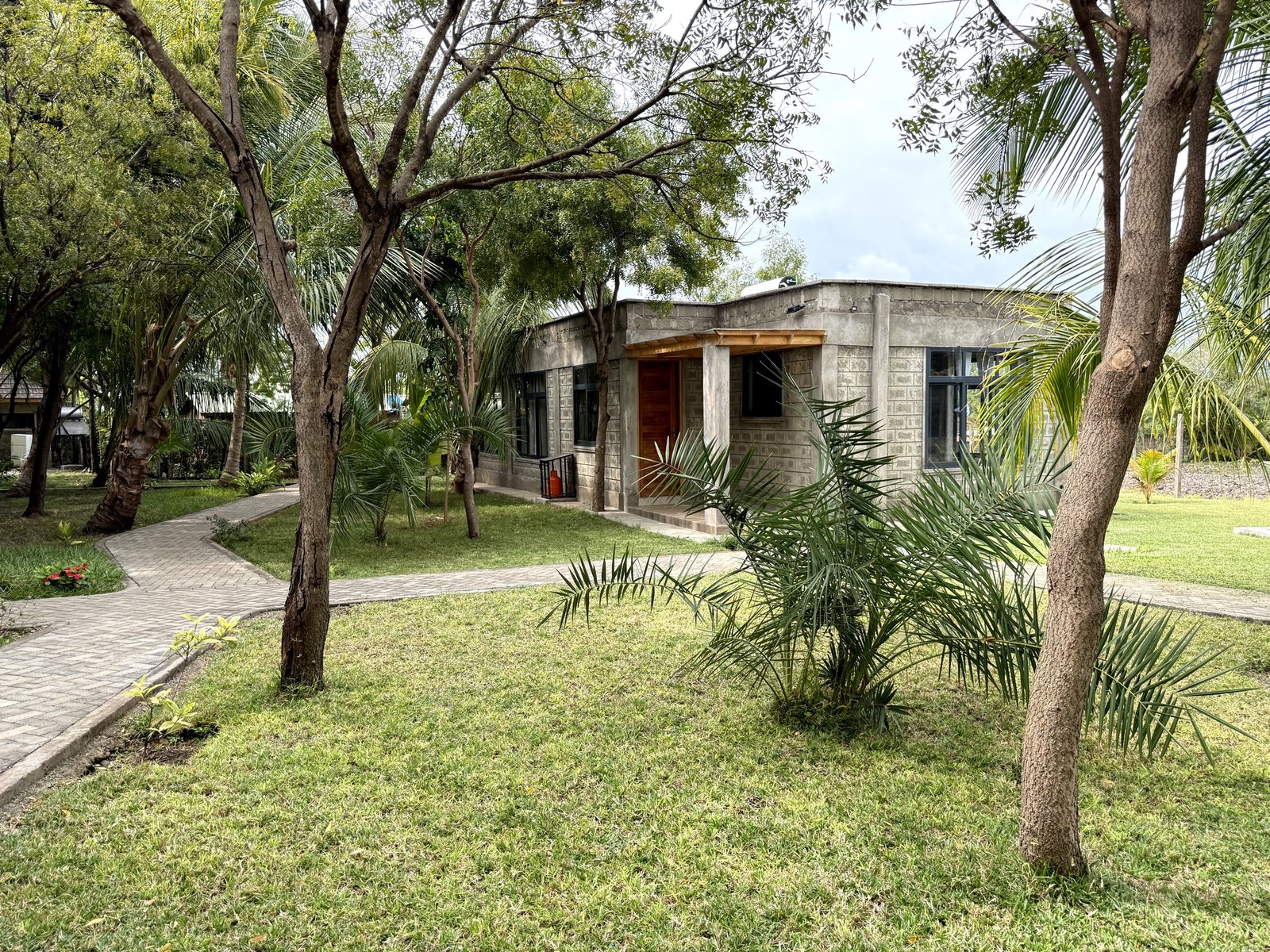 Cottage exterior framed by trees