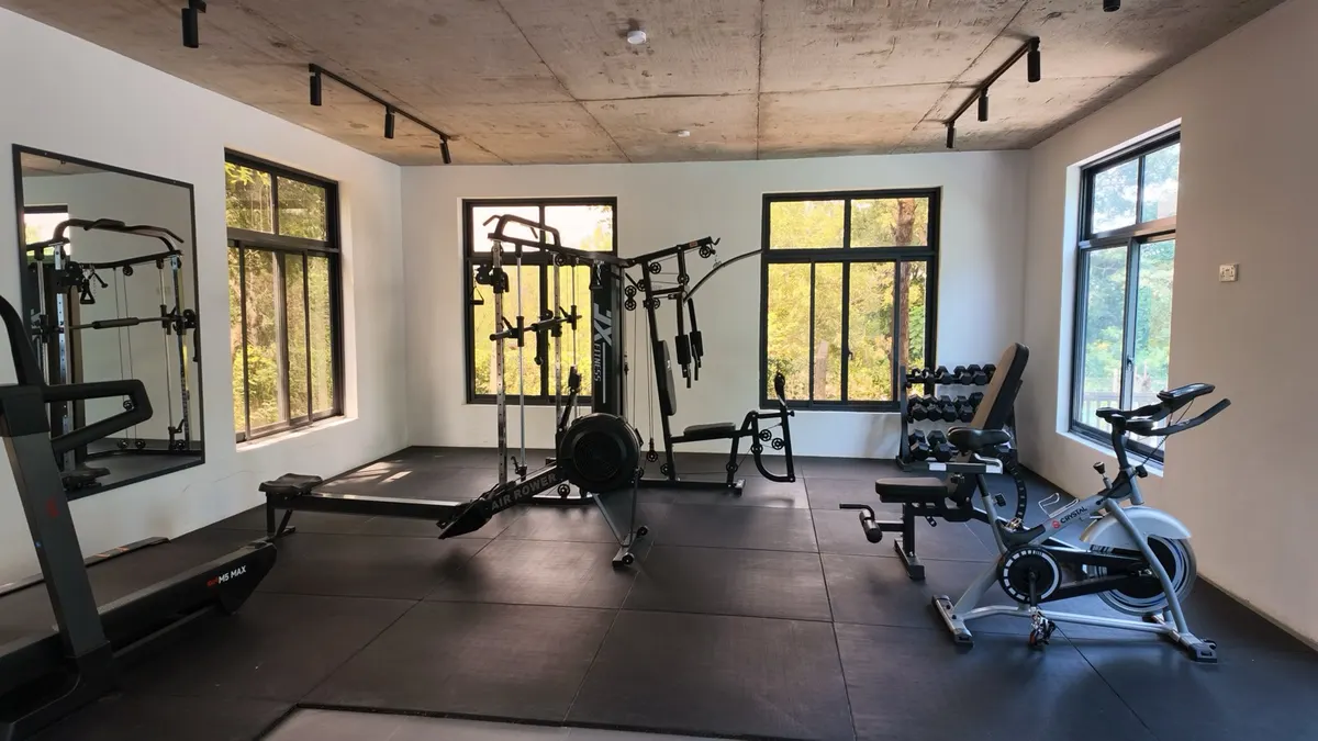 The Nagira gym, fully equipped with garden-facing windows