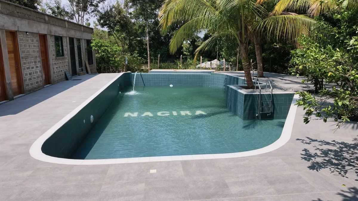The Nagira name tiled into the floor of the pool
